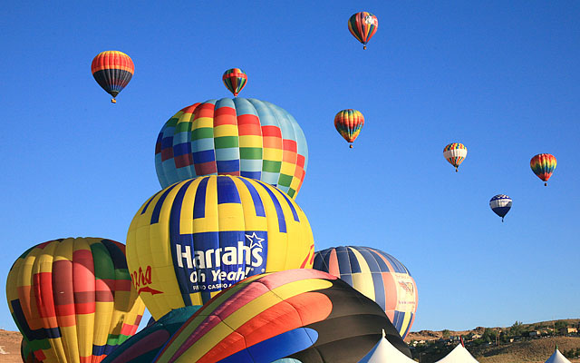 The yellow and blue balloon is "Cheers" piloted by David Wakefield of Sacramento, CA and sponsored by Harrah's Reno.