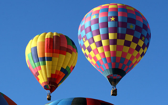 The balloon on the right appears to be "Check-It-Out" piloted by Mike Kijak of Windsor, California.