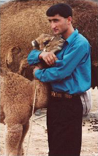 Man hugging camel